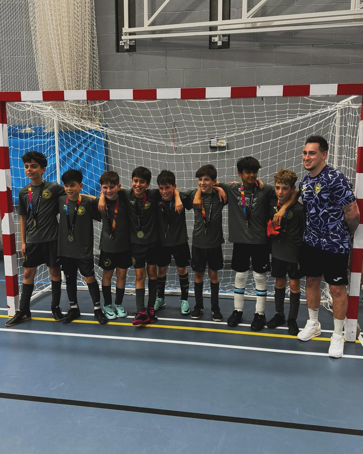 U11 team celebrating with medals